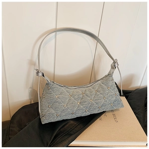 Light blue denim baguette bag with quilted diamond pattern and silver rivets for women