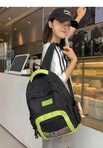 Detailed close-up of nylon backpack featuring mesh pocket and lime green accents