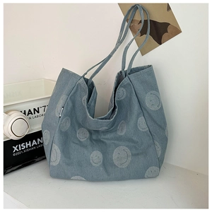 Blue denim tote bag with minimalist white smile pattern for stylish street leisure wear