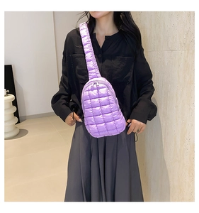 Close-up of lightweight lavender quilted nylon chest bag with wide shoulder strap details