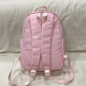 Zaino minimalista in nylon rosa da donna con spallacci imbottiti e tasche laterali capienti