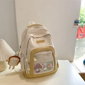 Minimalist nylon and mesh crossbody bag in beige and mustard with a cute plush charm