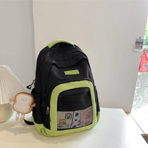 Minimalist nylon and mesh crossbody bag in black and lime green with cute plush charm