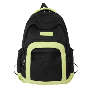 Minimalist black nylon backpack with neon green accents and mesh front pocket detail