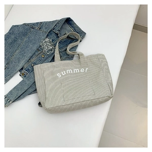 Chic black and white striped canvas tote bag with Summer print and blue denim styling