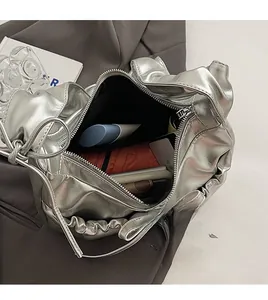 Detailed interior of silver ruched PU shoulder bag showing spacious storage capacity