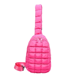 Quilted rose pink nylon crossbody bag with adjustable strap and dual zippers
