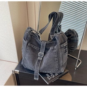 Fashionable black washed denim crossbody bag with multi-pocket design for summer