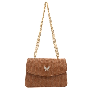 Brown woven crossbody bag with golden chain strap and white butterfly buckle decoration