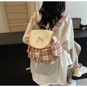 Pink and beige plaid canvas backpack featuring a delicate pink embroidered bow detail