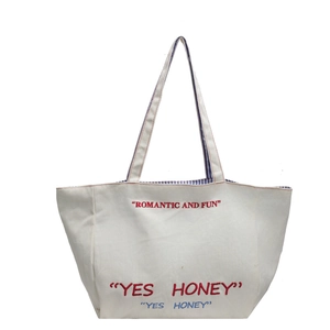 Minimalist canvas tote bag with Romantic and Fun embroidery and blue striped lining