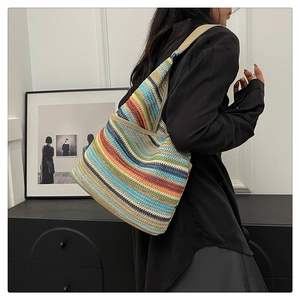 Detail of colorful horizontal striped knit tote bag showing vibrant texture and capacity