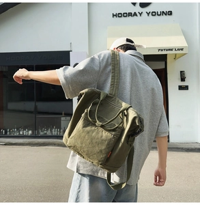 Street style shot of an army green canvas tote backpack with adjustable wide shoulder straps