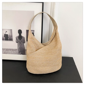 Minimalist knit crescent tote bag with leather trim and stylish woven texture for women