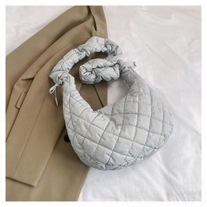 Minimalist light grey quilted crescent bag with scrunched shoulder strap for women