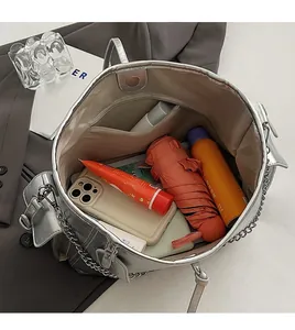 Top view of spacious silver tote bag interior with organized daily essentials and zip pocket