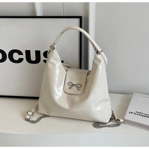 Chic cream white PU leather hobo bag with metallic bow detail and chain strap