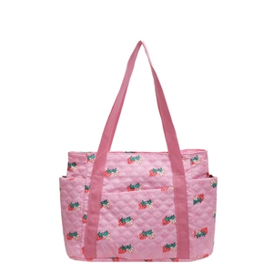 Pink quilted fabric tote bag featuring strawberry prints and long shoulder straps