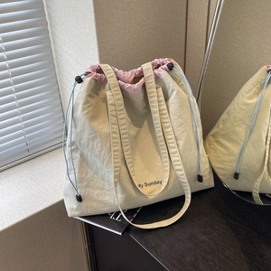 Chic beige fabric drawstring tote bag with My Sunday strap and pink lining accents