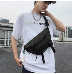 Black nylon fanny pack with SHILAIEN logo and adjustable buckle strap on female model