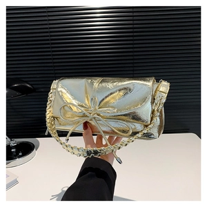 Metallic gold PU handbag with large bow and pleated texture for fashion-forward women