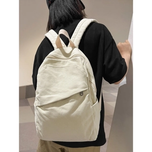 Minimalist large canvas backpack in cream white, spacious travel bag for students
