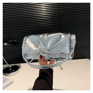Metallic silver PU leather handbag with large bow decoration and woven handle