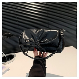 Glossy black PU leather tote bag with pleated texture and stylish bow tie detail