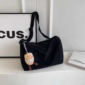Black canvas shoulder bag with large capacity and cute coffee plush charm detail