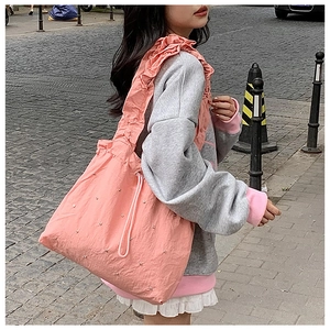 Pink pleated nylon tote bag with pearl accents and wide ruffled shoulder strap