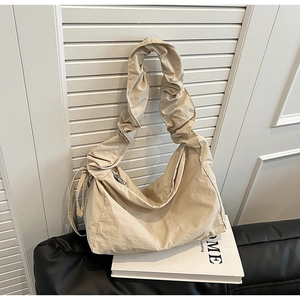 Chic beige nylon tote bag with pleated ruched shoulder strap and casual hobo design