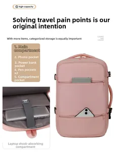 Pink waterproof oxford backpack detail showing multiple interior laptop compartments