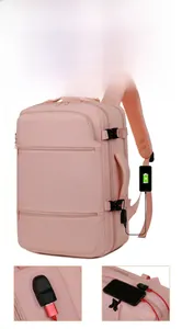 Pink waterproof backpack featuring an external USB charging port and functional compartments