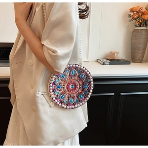 Detail view of cotton linen crossbody bag with mandala pattern and pearl strap