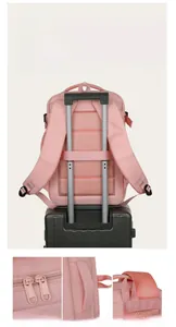 Pink travel backpack with suitcase strap and dual metal zippers for easy mobility