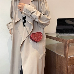 Chic red heart-shaped sequin crossbody bag with a slim silver metal chain strap