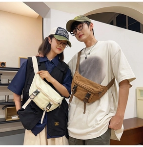 Detail showing couple wearing canvas crossbody bags in off-white and tan colors