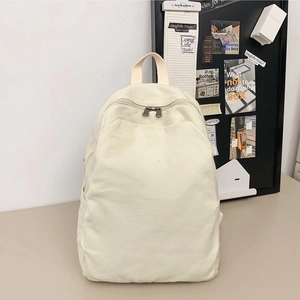 Minimalist cream white canvas backpack for women featuring a double zipper and side pockets