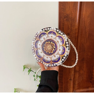 Fashionable round linen crossbody bag with pearl trim and purple mandala pattern design