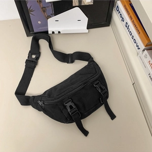 Minimalist black canvas crossbody chest bag with adjustable dual buckle design
