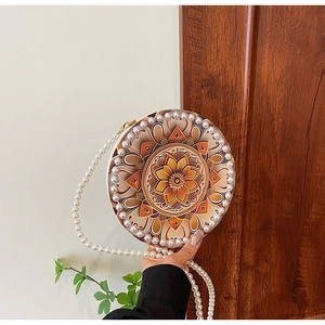 Round summer crossbody bag with mandala print and decorative faux pearl trim