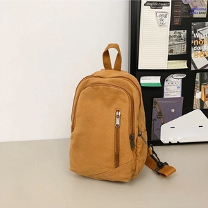 Minimalist ginger yellow canvas crossbody bag for women with adjustable strap and zipper pocket