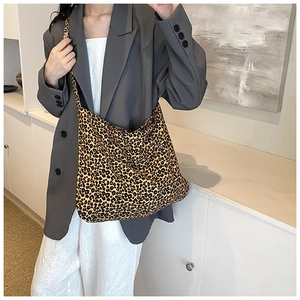 Close-up of leopard print oversized hobo bag with soft fabric and minimalist casual style