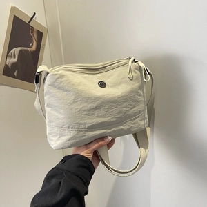 Chic beige nylon multi-layer crossbody bag with triple zippers and woven strap