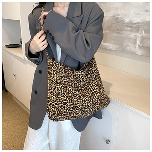 Chic leopard print hobo tote bag shown on model for a trendy daily commuting style
