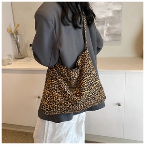 Fashionable leopard print oversized canvas tote bag styled with a minimalist outfit