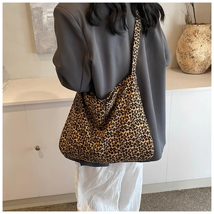 Detail of leopard print tote bag showing large capacity and soft fabric on the shoulder