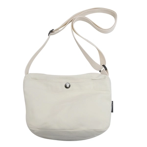 Minimalist off-white canvas crossbody bag for women with round metal snap closure
