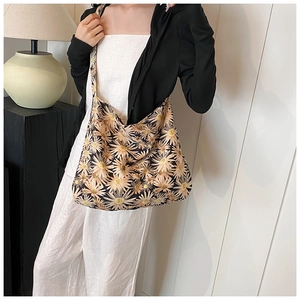 Close-up of women's daisy floral tote bag showing large capacity and soft canvas material