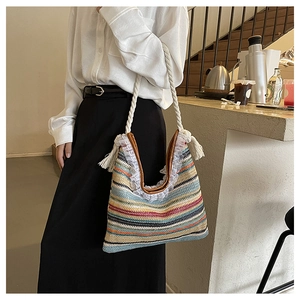 Detailed macro view of woven colorful tote bag with white lace trim and cotton rope strap